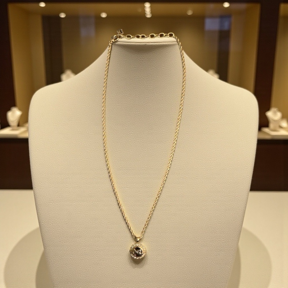 Nina Ricci Gold Necklace with Pendant